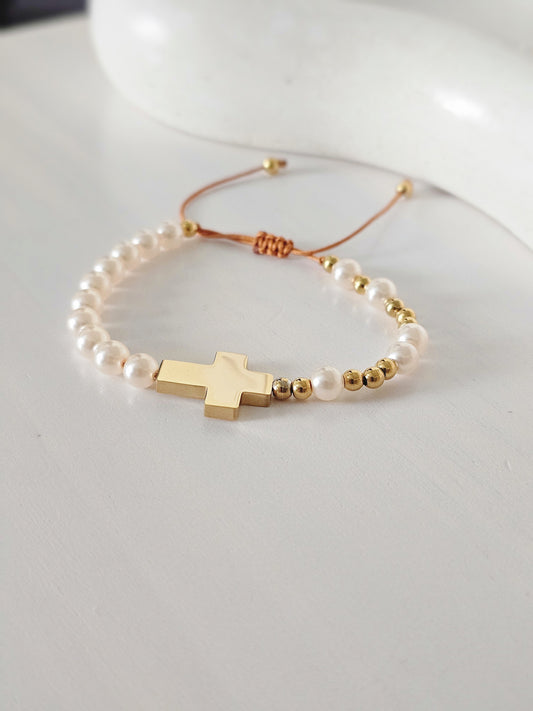Cruz y perlas